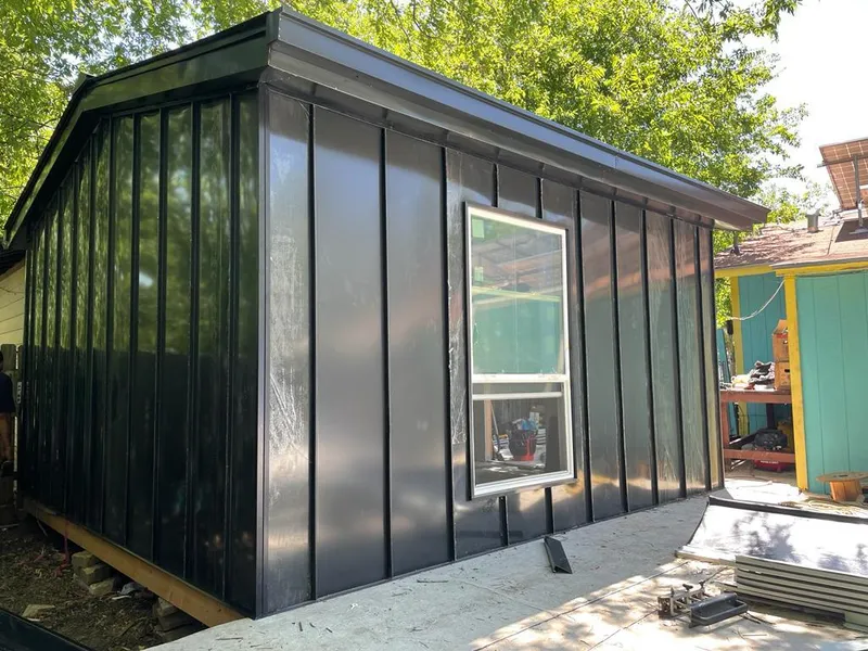 Black standing seam metal wall panels for Roof Inspection in South Patrick Shores